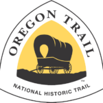 Oregon National Historic Trail marker is a triangle-shaped sign featuring a brown or black covered wagon against a yellow background