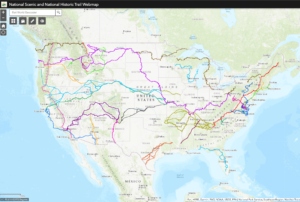 Graphic map of the United States with National Trails overlayed in a variety of colors.