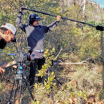 Three men in the field with camera an boom mike film the Arizona Trail Skills Video Series