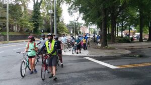 Lilienthal leads a group of youth on a community bike ride