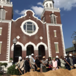 Church members, Governor Ivey, and Congresswoman Sewell pose with shovels in front of Brown Chapel
